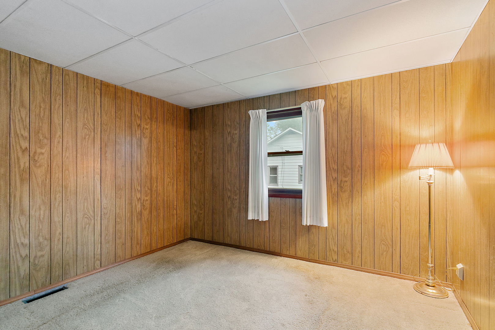 148 Holly Street DeKalb, IL 60115 - Photo 19 of 27 an empty room with a wooden door