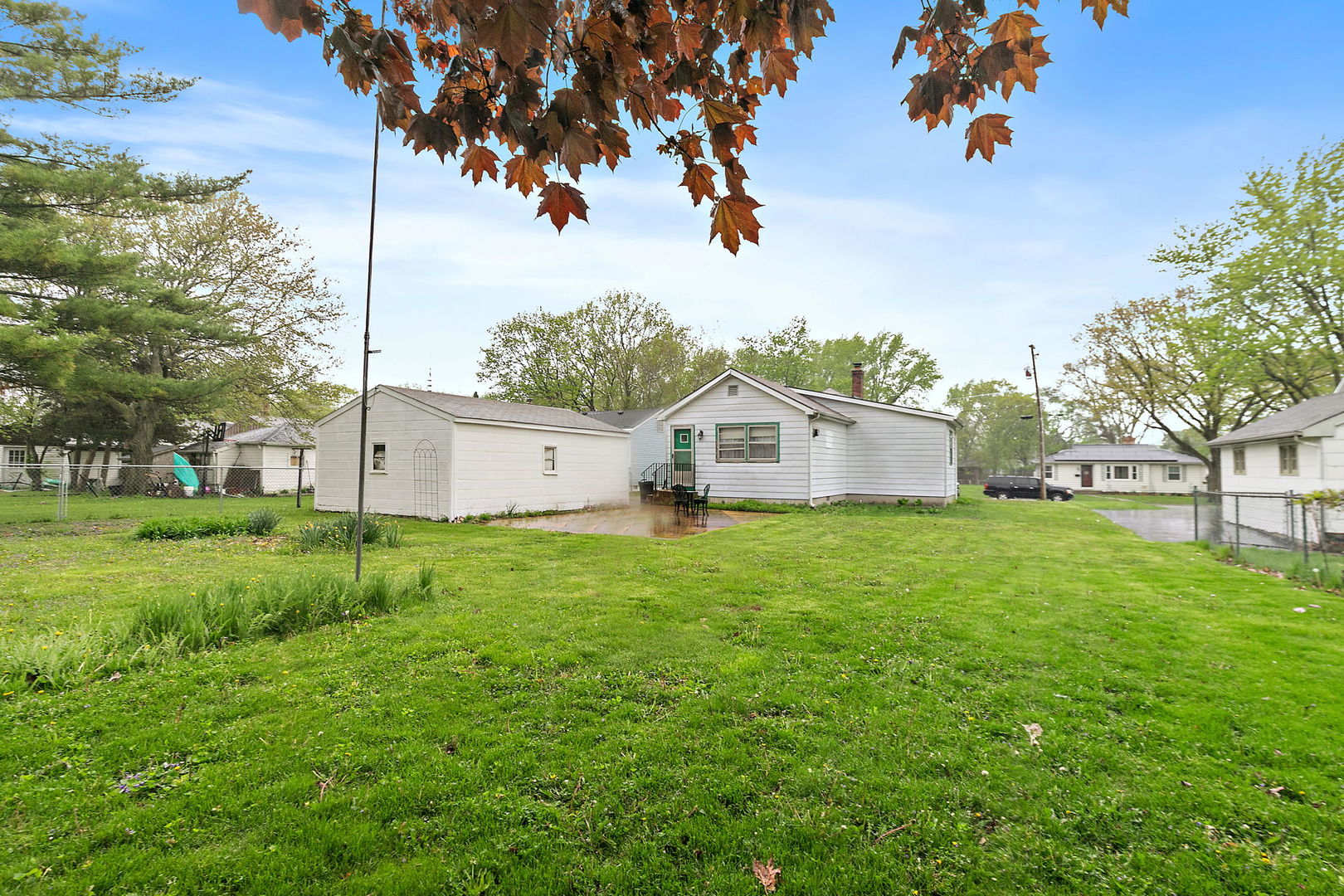 148 Holly Street DeKalb, IL 60115 - Photo 25 of 27 a view of a house with yard and tree s