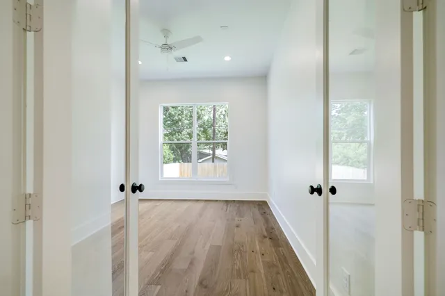 a bathroom with a double vanity sink mirror and bathtub