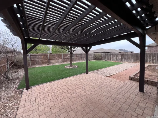 a view of a backyard of the house