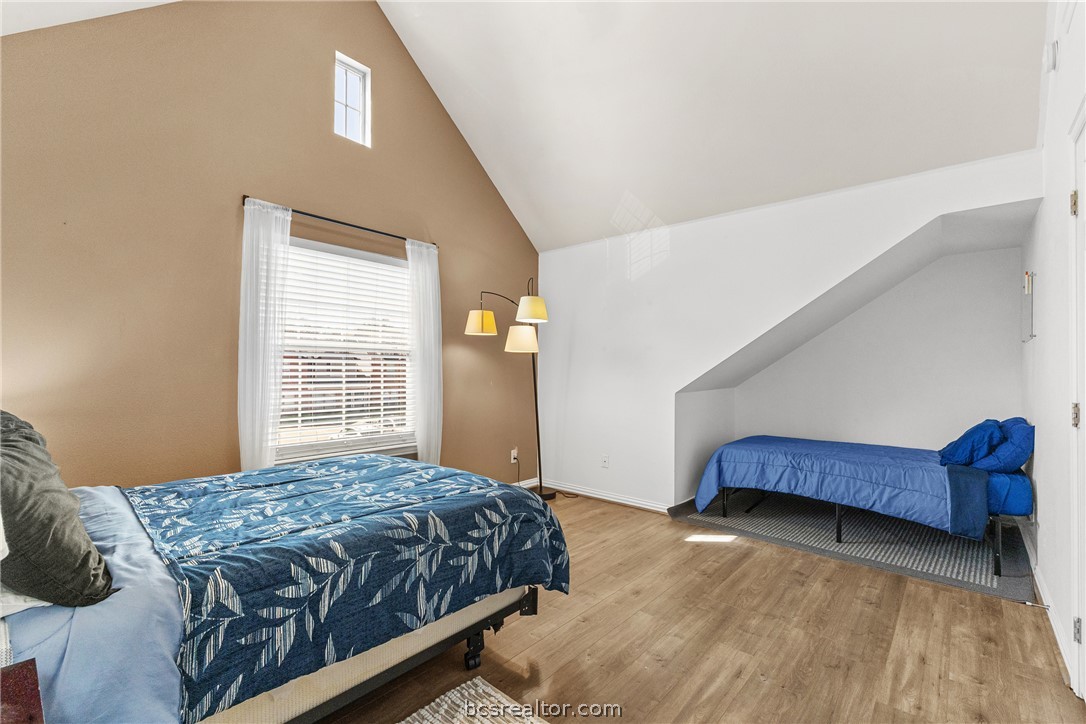 1001 Krenek Tap Road, Unit 1306 College Station, TX 77840 - Photo 16 of 22 a bedroom with a bed and a dresser