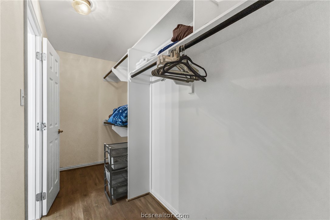 1001 Krenek Tap Road, Unit 1306 College Station, TX 77840 - Photo 18 of 22 a view of hallway with stairs and a chandelier