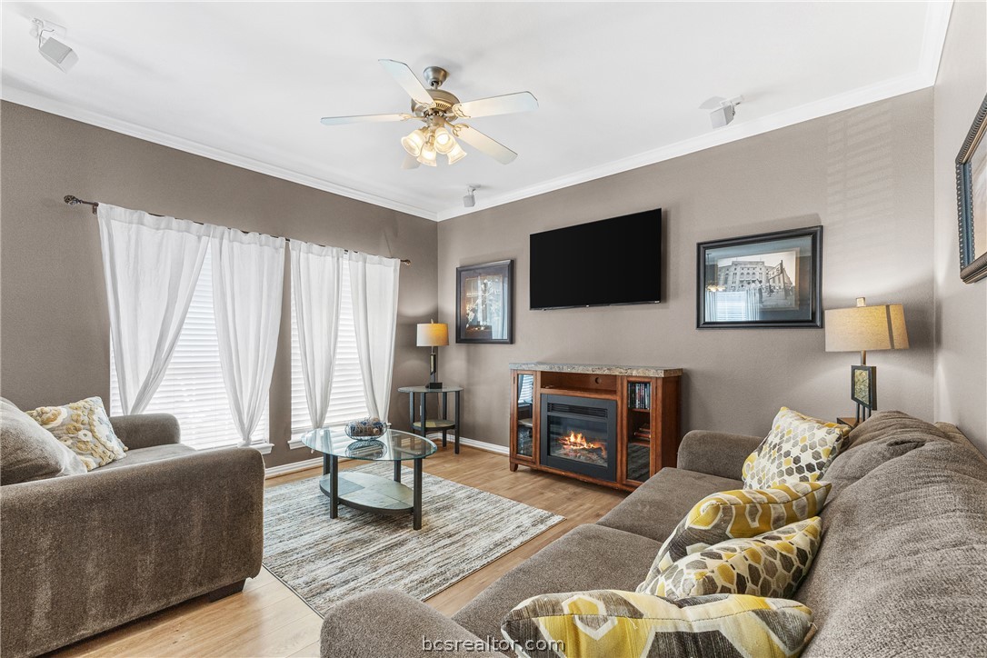 1001 Krenek Tap Road, Unit 1306 College Station, TX 77840 - Photo 2 of 22 a living room with furniture and a flat screen tv
