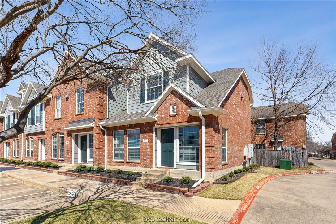 1001 Krenek Tap Road, Unit 1306 College Station, TX 77840 - Photo 21 of 22 a front view of a house with yard