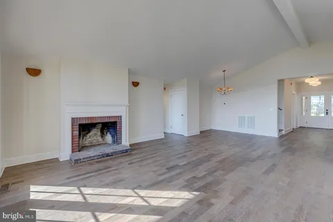 a bathroom with a granite countertop double vanity sink and a mirror