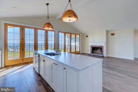 a view of room with window and wooden floor