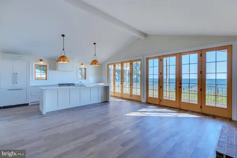 a bedroom with a bed and a potted plant