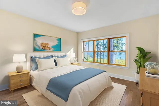 a view of a backyard with swimming pool and sitting area