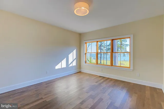 a view of a lake with houses in the back