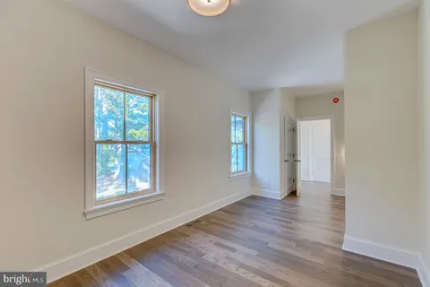 a view of a large body of water with a building in the background