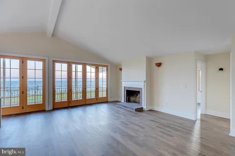 a view of entryway with wooden floor and window