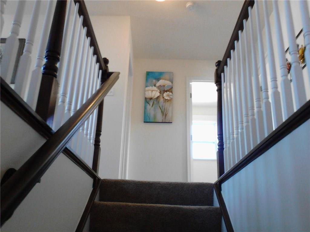 213 West Country Barn Road Houston, PA 15342 - Photo 13 of 17 Stairway to upper level-bedroom level. 2nd floor laundry shown in background (stock photo)