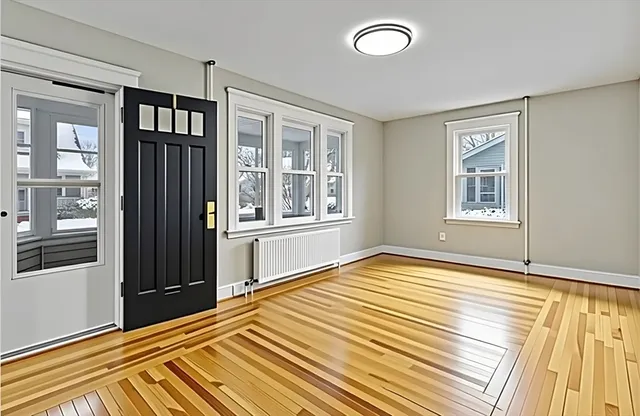 a bedroom with windows