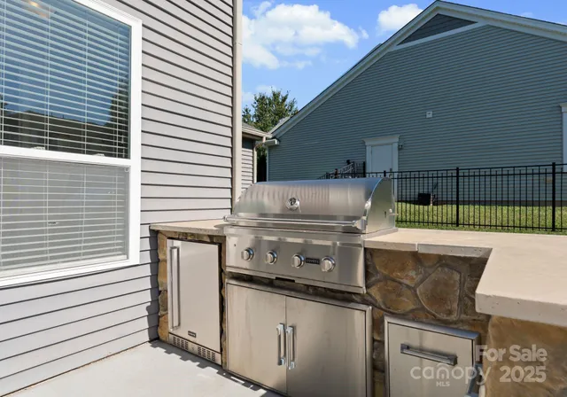 a kitchen view with a sink and stove