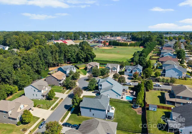 an aerial view of a houses with a outdoor space