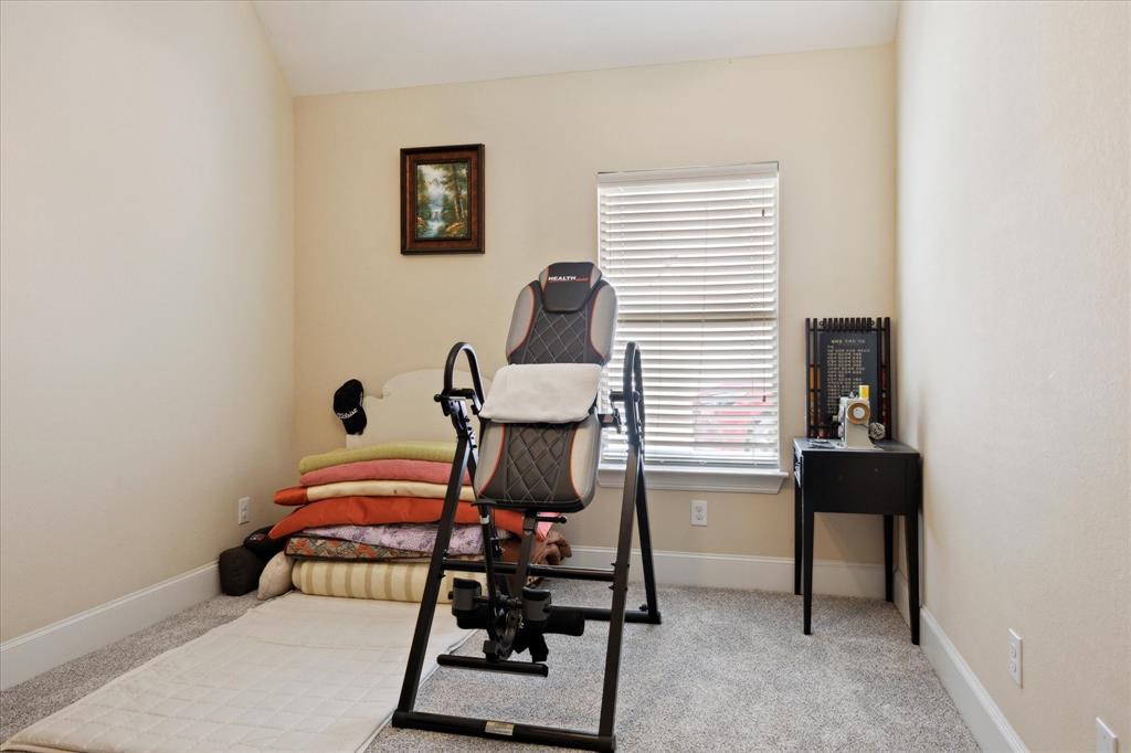 119 George Owens Road Ponder, TX 76259 - Photo 18 of 26 Versatile room featuring light-toned walls, gray carpet, and white baseboards