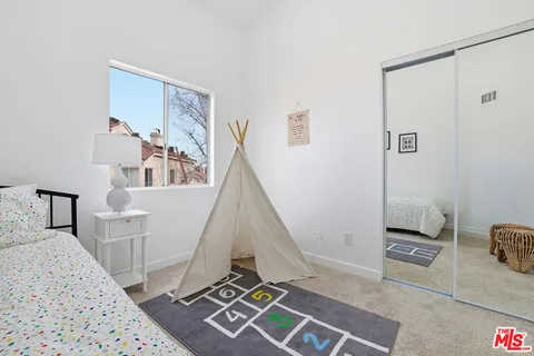 a view of livingroom with furniture and floor to ceiling window