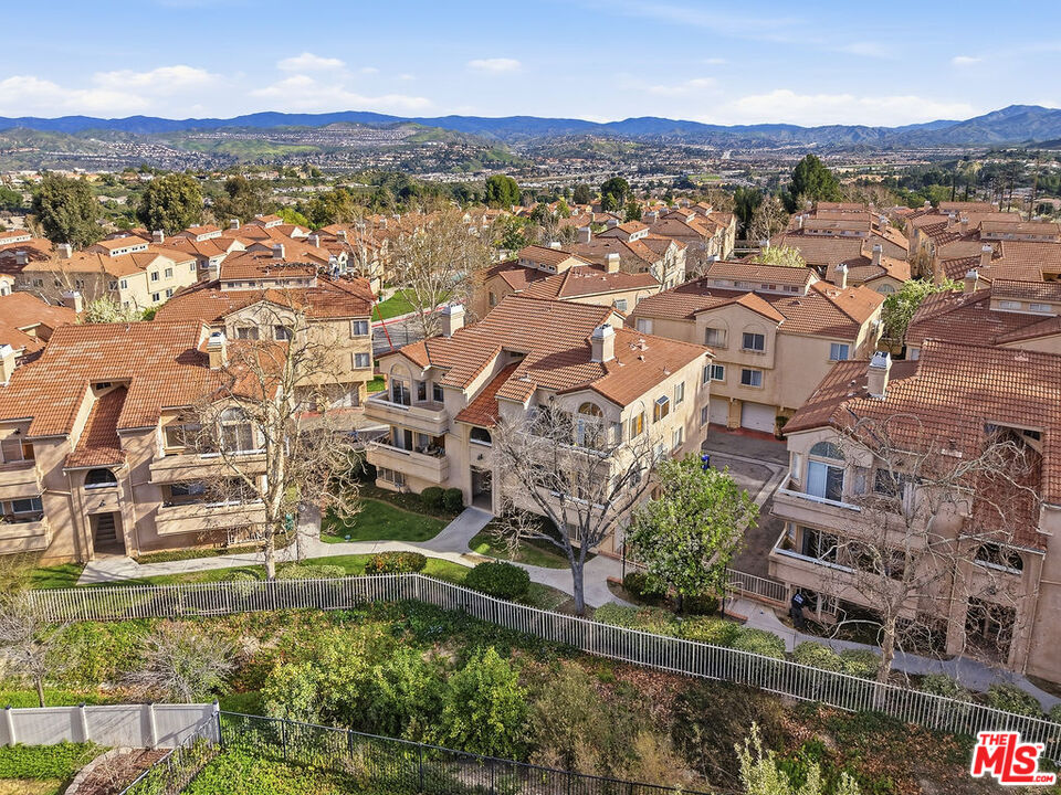19834 Sandpiper Place, Unit 64 Newhall, CA 91321 - Photo 38 of 40 an aerial view of residential houses with outdoor space