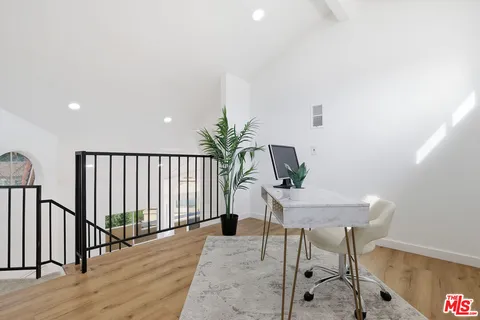 a workspace with furniture and wooden floor
