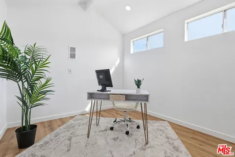 a view of a workspace with furniture