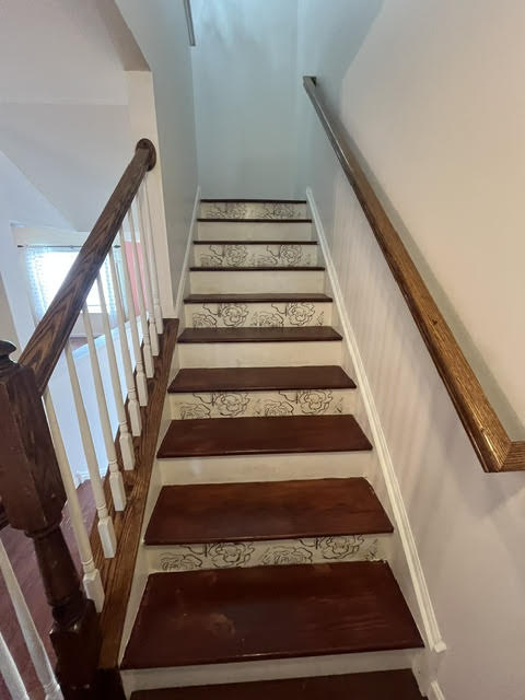 2212 Rising Hill Road Whitehall, PA 18052 - Photo 10 of 21 Artistic flair graces the stair risers, elevating this functional space with a touch of elegance.