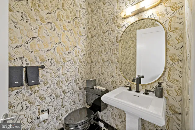 a view of a roof deck with couches chairs and wooden floor