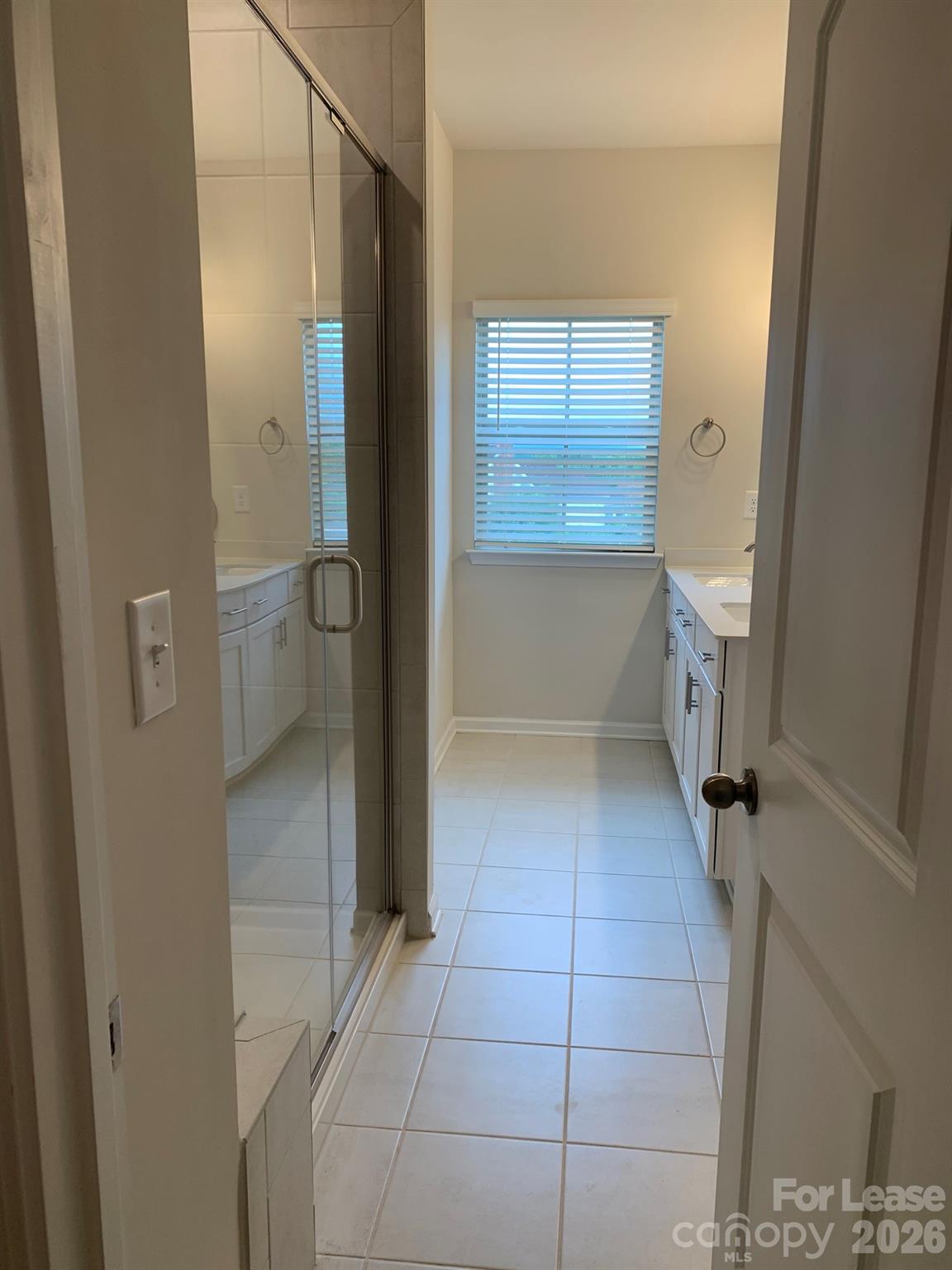2143 Stevens Mill Road Matthews, NC 28104 - Photo 19 of 39 a bathroom with a sink a toilet and shower