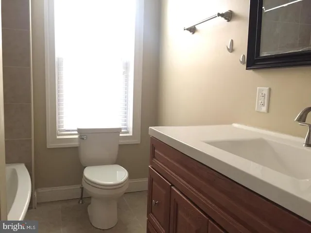 a bath tub sitting next to a shower