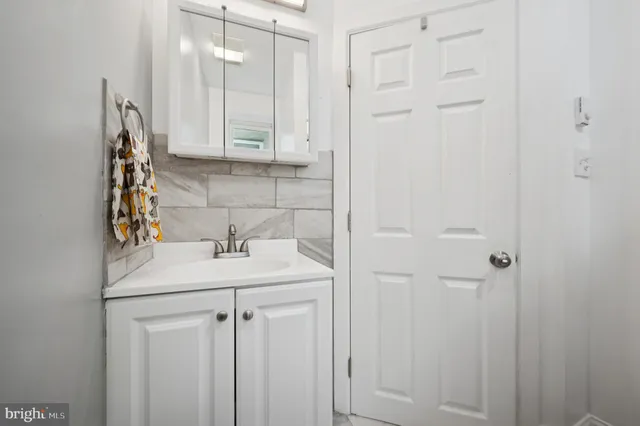 a bathroom with a sink and vanity