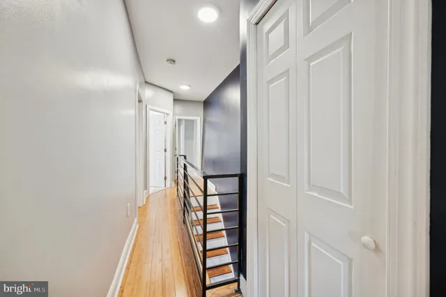 a view of entryway with stairs and wooden floor