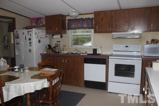 8121 Smith Road Apex, NC 27539 - Photo 8 of 9 Large kitchen has utility room and very large unfinished storage space!