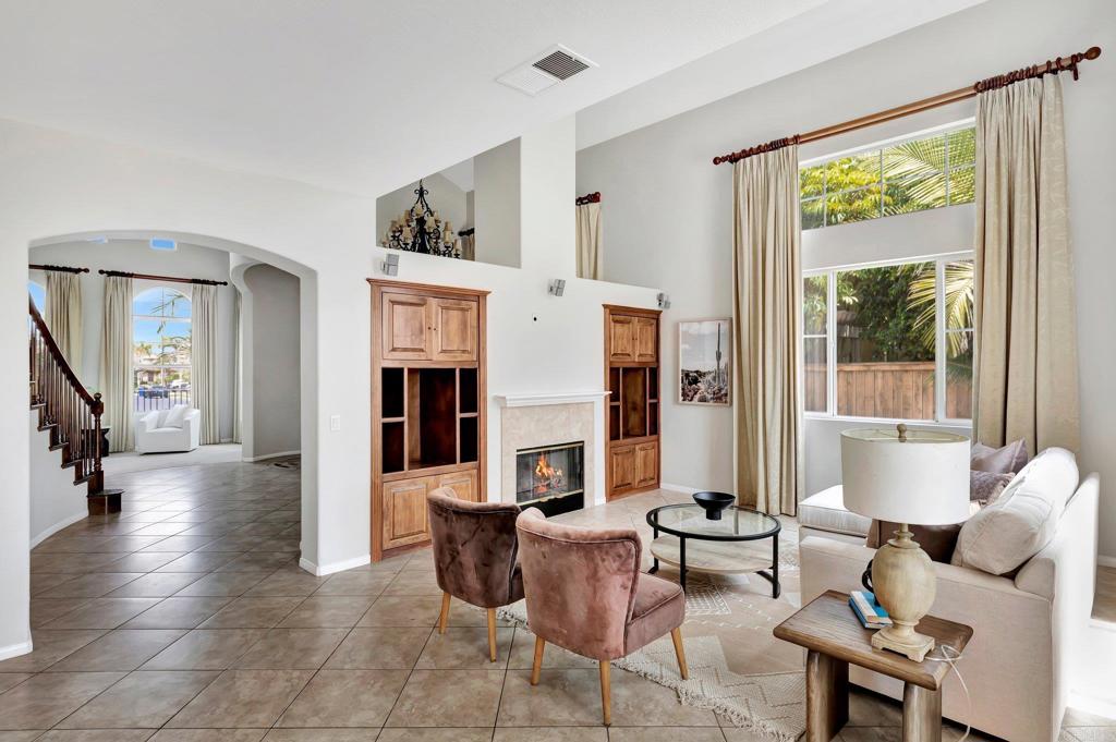 923 Merced River Road Chula Vista, CA 91913 - Photo 1 of 1 a living room with fireplace furniture and a large window