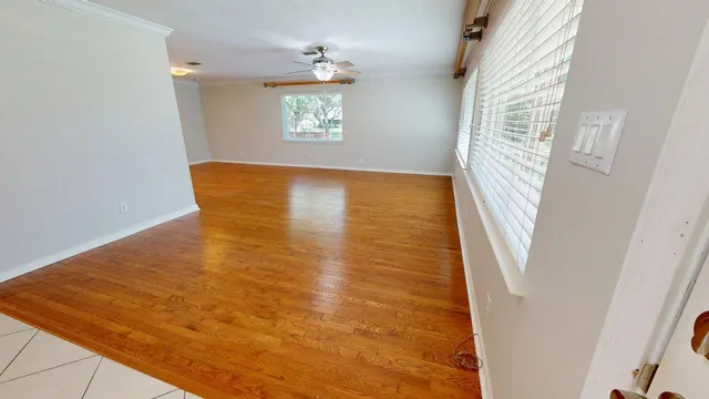 a bathroom with a granite countertop toilet sink and mirror