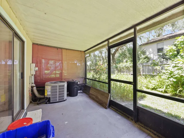 a room with furniture and large windows