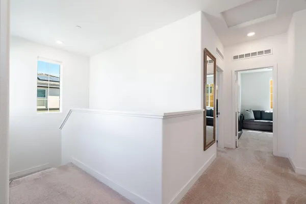 a livingroom with workspace and a window