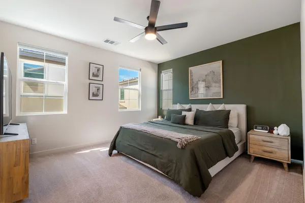 a bathroom with a double vanity sink a mirror and a bathtub