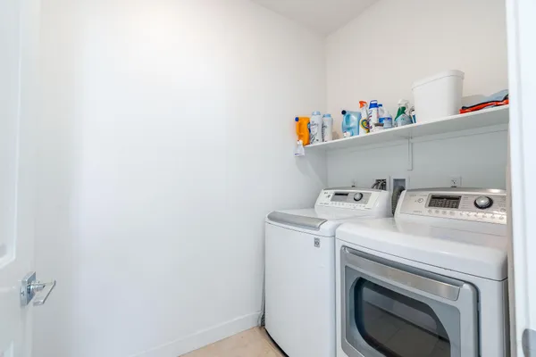 a living room with furniture and a rug