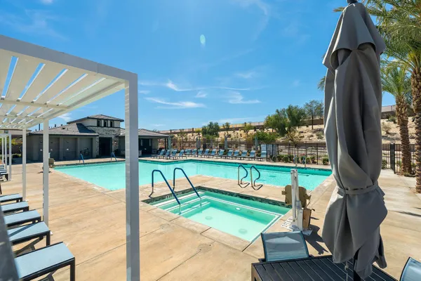 an aerial view of a residential building and an ocean view