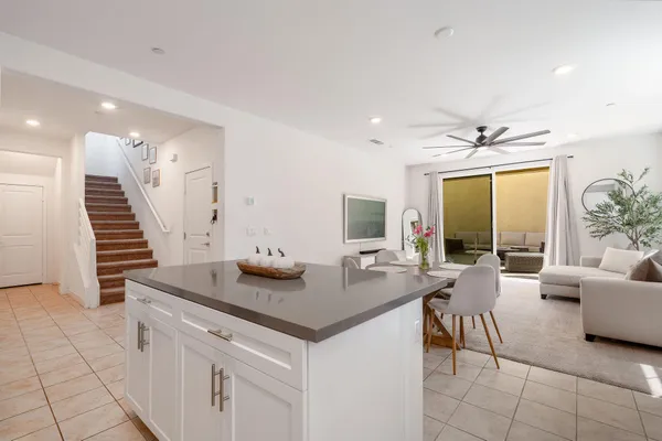a view of a livingroom with furniture and a potted plant