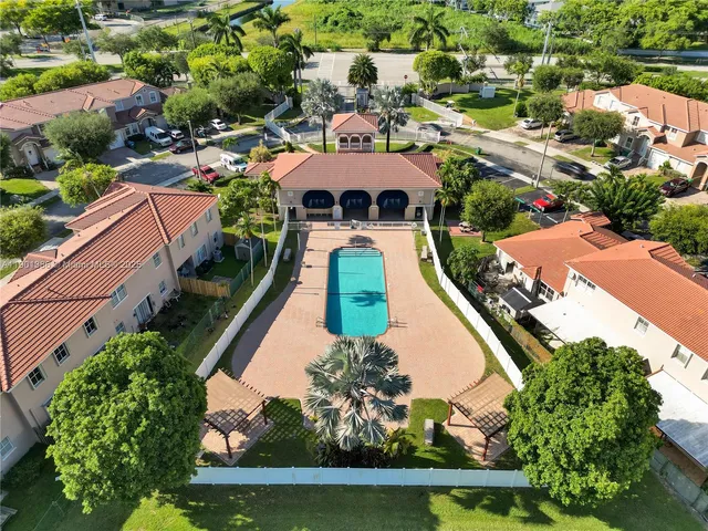 an aerial view of a house with a garden