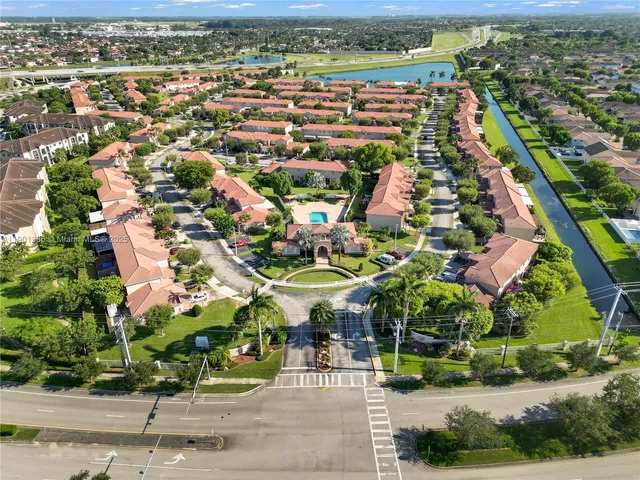 an aerial view of residential houses with outdoor space