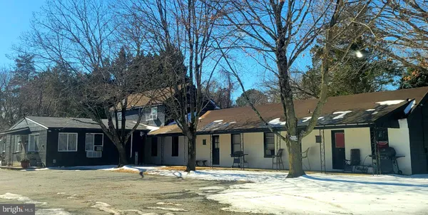 a view of a building with a large tree