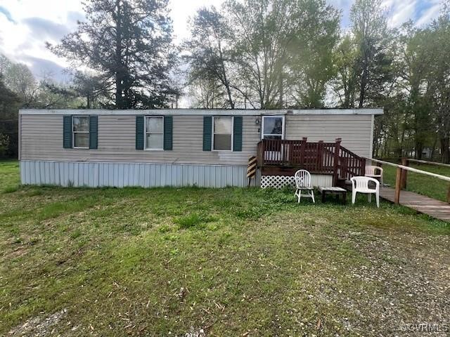 View of front facade featuring a deck and a front