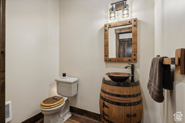 6117 North Rocky Ridge Road Peoa, UT 84061 - Photo 54 of 83 Bathroom with hardwood / wood-style flooring, sink, and toilet