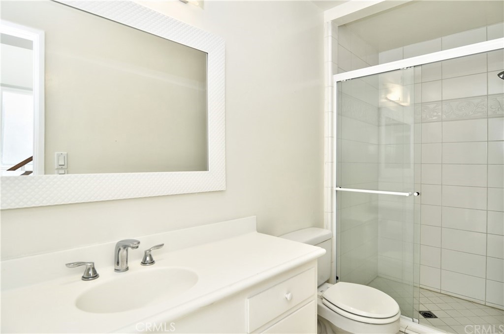401 Canal Street Newport Beach, CA 92663 - Photo 24 of 27 a bathroom with a sink toilet and shower