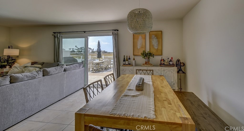 401 Canal Street Newport Beach, CA 92663 - Photo 9 of 27 a living room with furniture and a large window