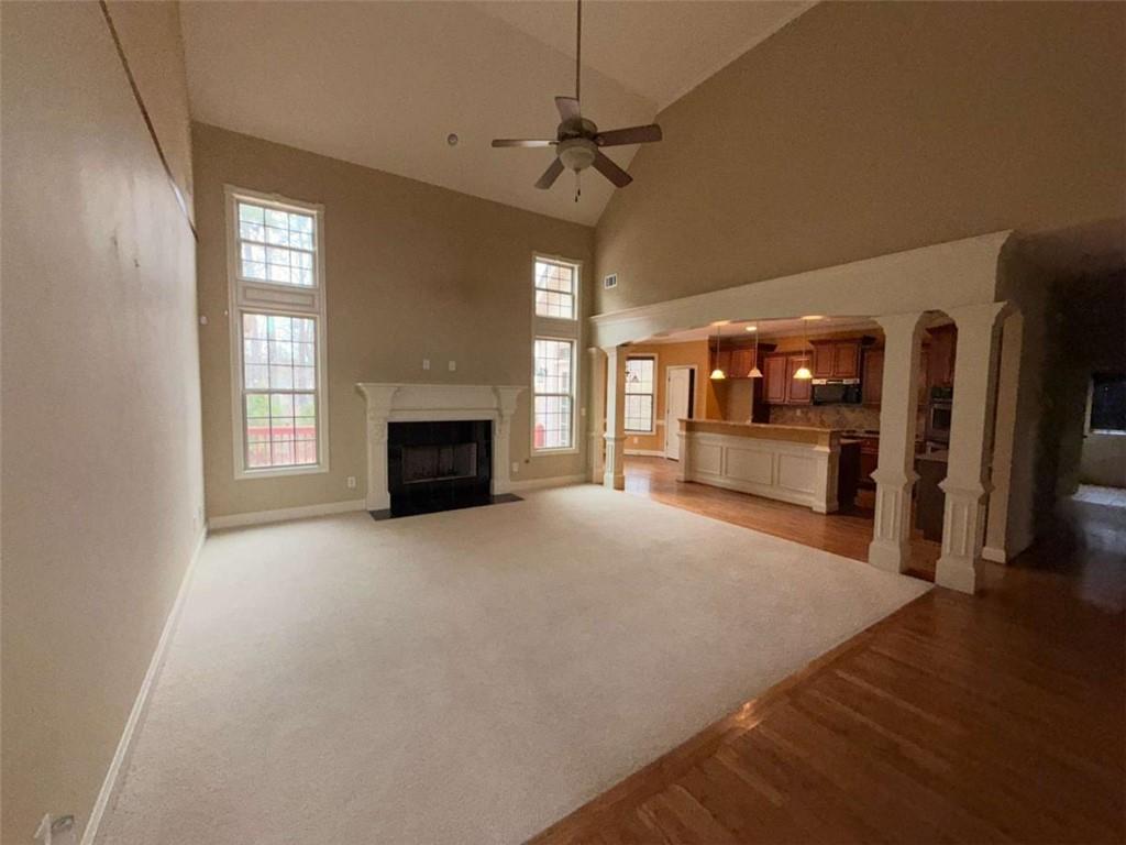 75 Cannonade Court Covington, GA 30016 - Photo 13 of 20 a view of an empty room with a fireplace and a window