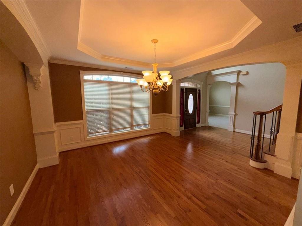 75 Cannonade Court Covington, GA 30016 - Photo 15 of 20 a view of a livingroom with wooden floor and a ceiling fan
