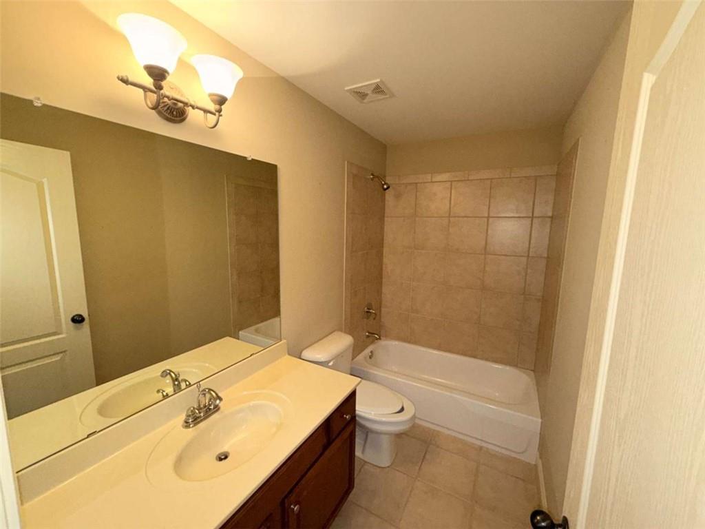 75 Cannonade Court Covington, GA 30016 - Photo 20 of 20 a bathroom with a sink a toilet and shower