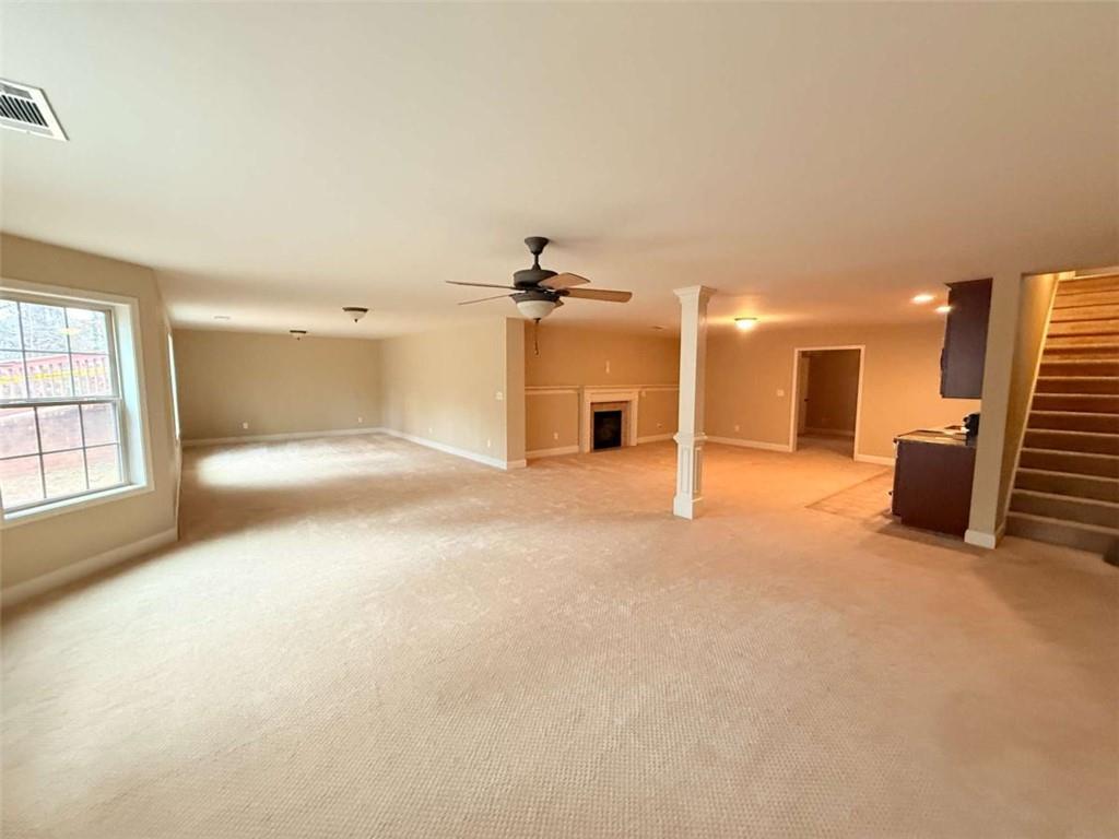 75 Cannonade Court Covington, GA 30016 - Photo 6 of 20 a view of a livingroom with furniture staircase and windows